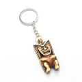 Resin Tiki statue keychain with a faux bone finish and tribal mask carving details - Antique Pale Yellow Style (F-1)