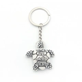 Souvenir turtle keychain with Cabo Verde engraving on white resin shell with silver ring - White