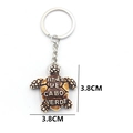 Turtle resin keychain with Cabo Verde print and silver ring for souvenir use - Red Brown