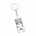 Polynesian Tiki resin keychain featuring cream faux bone finish and black tribal patterns - Creamy White Black Pattern Style (E-2)