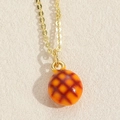 Exquisite gold necklace with orange-brown heart charm and lattice texture detail - Orange Grid Bead Style