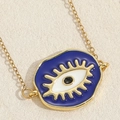Evil Eye heart pendant necklace in gold finish with blue enamel and eyelash detail - Blue Disk Eye Style