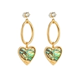 Detail of 14k gold heart earrings with natural shell inlay and LOVE engraving - Style Seven (ES0024-7)