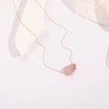 Minimalist 14k gold plated necklace with raw natural rose quartz pendant on white background - Rose Quartz Raw Stone Style (XL0136) / 14k