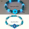 Close-up of blue beaded bracelet with flower charm showing day and night glow effects - 1# Luminous Blue