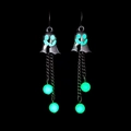 Luminous ghost earrings with glowing green beads and long silver tassel chains on black background - Green Glow Ghost