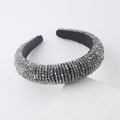 Close-up of padded headband with grey faceted crystals and black velvet lining - Grey Crystal