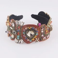 Ornate Baroque headband with red heart gems, colorful rhinestones, and gold tassel details - Luxury Baroque Style