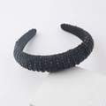Detail of a thick black padded headband covered in faceted crystals on white props - Pure Black Style (F)