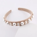 Elegant beige fabric headband with white faux pearls and gold floral accents on white background - Brown