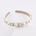 Elegant white fabric headband with vintage pearls and gold scalloped trim on white stand - Off White