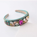 Detail of baroque headband featuring colorful rhinestones and vibrant gemstones - Green