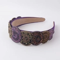 Macro shot of purple beaded headband with handcrafted circular sequin patterns - Purple