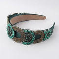 Detailed macro view of green fabric headband featuring baroque rhinestones and geometric jewels - Dark Green