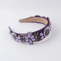 Detailed macro view of purple baroque headband with rhinestones and floral crystal patterns - Purple