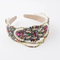 Close-up of luxury headband featuring colorful rhinestones, pearls, and fringe details - White Colorful