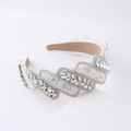 Detailed view of Baroque wide headband featuring white fabric with sparkling crystals - White