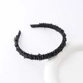 Detail shot of a black braided headband with shimmering crystal beads and sequins on a white base - Black
