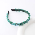 Macro detail of dark green beaded headband with shimmering sequins and crystal floral accents - Green