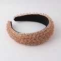 Close-up of rose gold beads and sequins on a thick black padded headband detail - Rose Gold