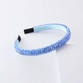 Close-up of light blue faceted crystal beads and satin ribbon wrap on a stylish headband - Sky Blue