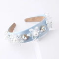 Close-up of light blue baroque headband with pearls and sparkling crystal flowers - Light Blue