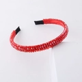 Detailed close-up of a red crystal headband featuring multifaceted beads and fabric tips - Red
