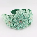 Detailed macro view of hand-sewn green beads and sparkling floral rhinestones on headband - Dark Green Style (E)
