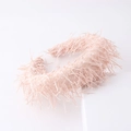 Detailed close-up of a light pink fringe headband featuring a soft and layered tassel texture - Light Pink (E)