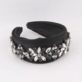 Detail of a padded wide black silk headband with sparkling rhinestone flower patterns - Black/White Zirconia