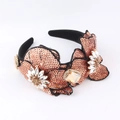 Detailed view of baroque headband featuring hand-stitched sequins and crystal flowers - Champagne Gold