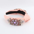 Pink fabric knotted headband with handcrafted crystals and pearls on white backdrop - Purple Gemstone Decor / Pink Satin Style (B)