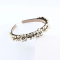 Baroque fashion headband with sparkling rhinestones and floral crystal pattern on black
