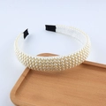 Detail of elegant pearl braided headband with multiple rows of white faux pearls on wood tray - Multi-row Pearl Style (A)
