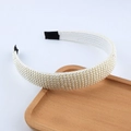 Detail of hand-woven white pearls on a stylish headband with black protective end tips - Parallel Row Style (C)