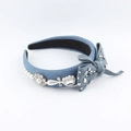 Detail showing blue denim headband with rhinestone flowers and faux pearl bow accents - Light Blue Denim Rivet Bow Style (E)