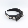 Detail of a denim padded headband featuring a large bow with pearls and sparkling rhinestones - Dark Denim Padded Bow Style (F)