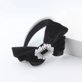 Detail of black velvet bow headband with faux pearls and rhinestones on a silver frame - Black and Silver