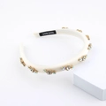 Handmade cream sponge headband with sparkling rhinestones on a minimalist white stand - Cream White (A)