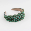 Close-up of luxury green rhinestone headband with emerald-cut crystals and gold settings - Emerald Green (F)