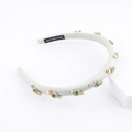 Detail showing handmade velvet headband with green rhinestones and crystal emerald gems - Grey Green (F)