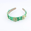 Close-up of green velvet headband with colorful rhinestone flowers and non-slip lining - Emerald Green