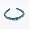Elegant peacock blue handmade headband with light blue rhinestones on a white stand - Peacock Blue With Light Blue Rhinestones (C)
