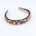 Macro shot of colorful rhinestones and crystal stones on a Baroque luxury headband - Black Base Colorful Gemstone Style