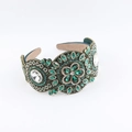 Macro shot of baroque emerald green headband with crystal gemstones and wide padded frame - Vintage Emerald Floral Style (A)
