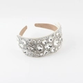 Detailed macro view of luxury baroque wide headband with densely inlaid sparkling crystals - White(D)