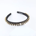 Detail of handcrafted black headband featuring leaf-shaped crystals and Hand Made label - Black (F)