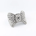 Baroque crystal bow headband featuring a large rectangular center stone and rhinestones - White