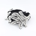Dettaglio del cerchietto in velluto nero con cristalli a forma di foglie di vite lusso - Strass Bianco (A)