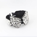 Luxe velvet headband featuring oversized rhinestone bow design for elegant party wear - Black